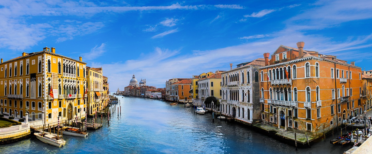 Romantic gondola ride through Venice canals during a spring morning