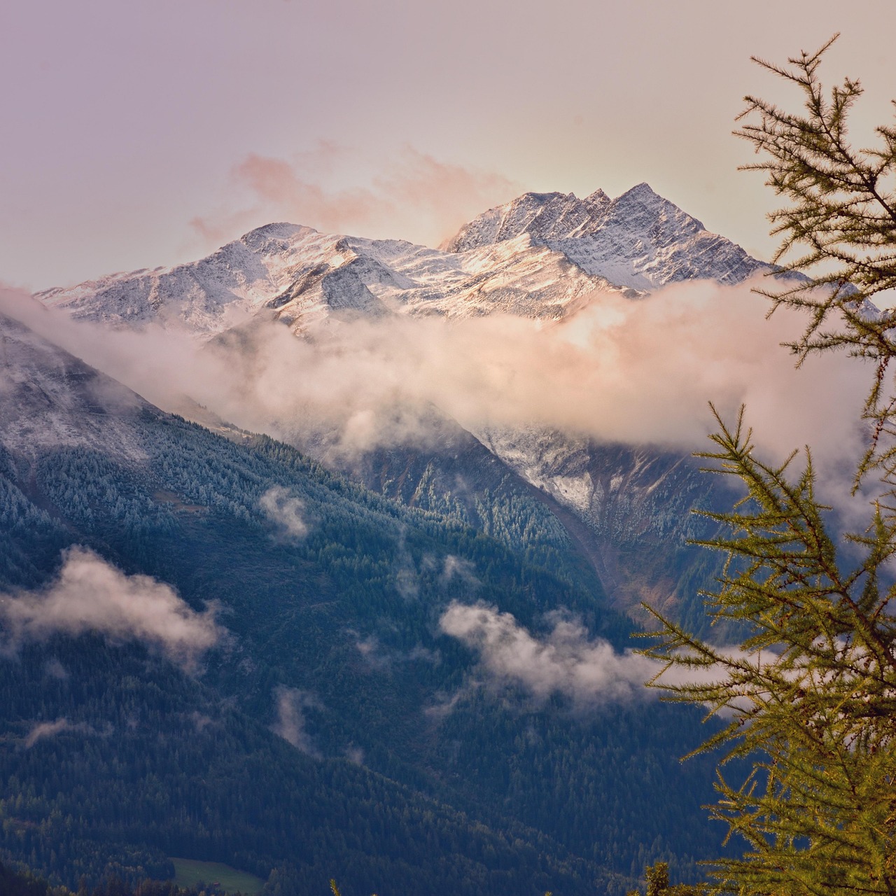 Snow‑capped Swiss Alps peaks visible from a scenic train route