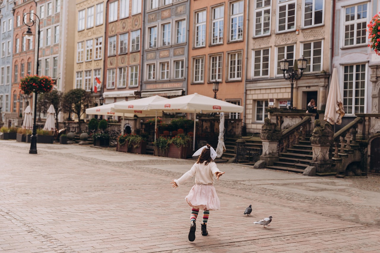 historic cobblestone street winding through poland old town