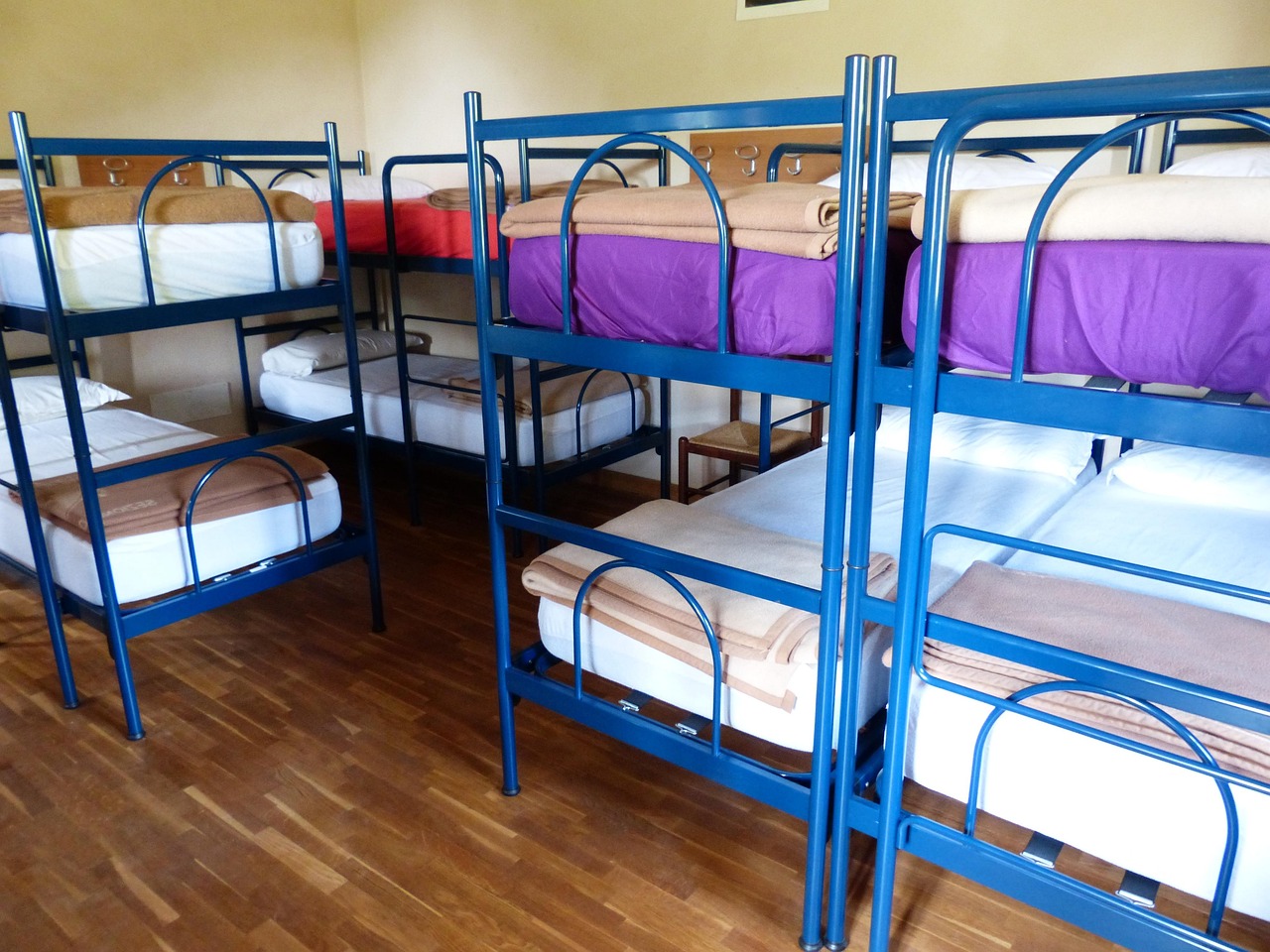 Young travelers bunk beds in a lively European hostel