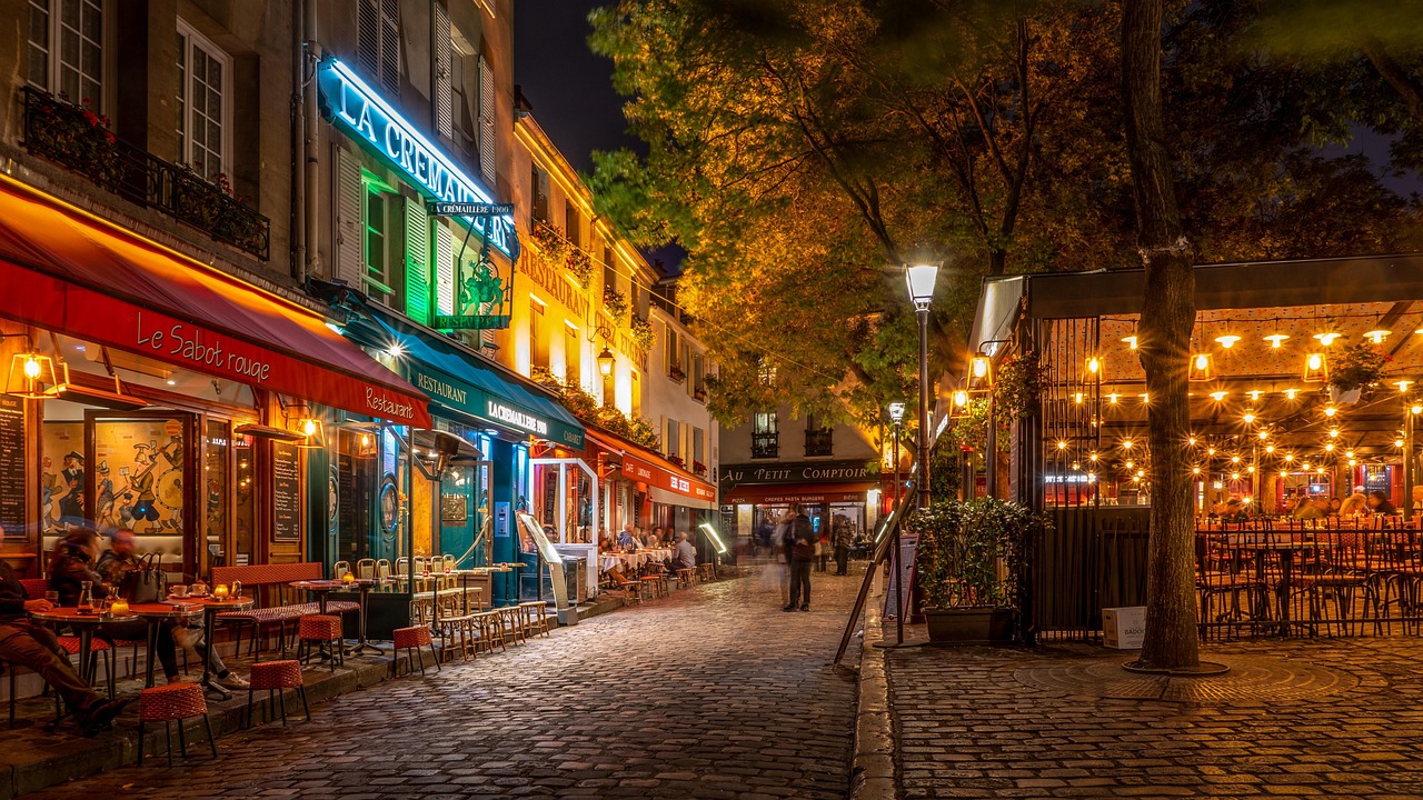 Couple enjoying coffee at a Paris sidewalk cafe
