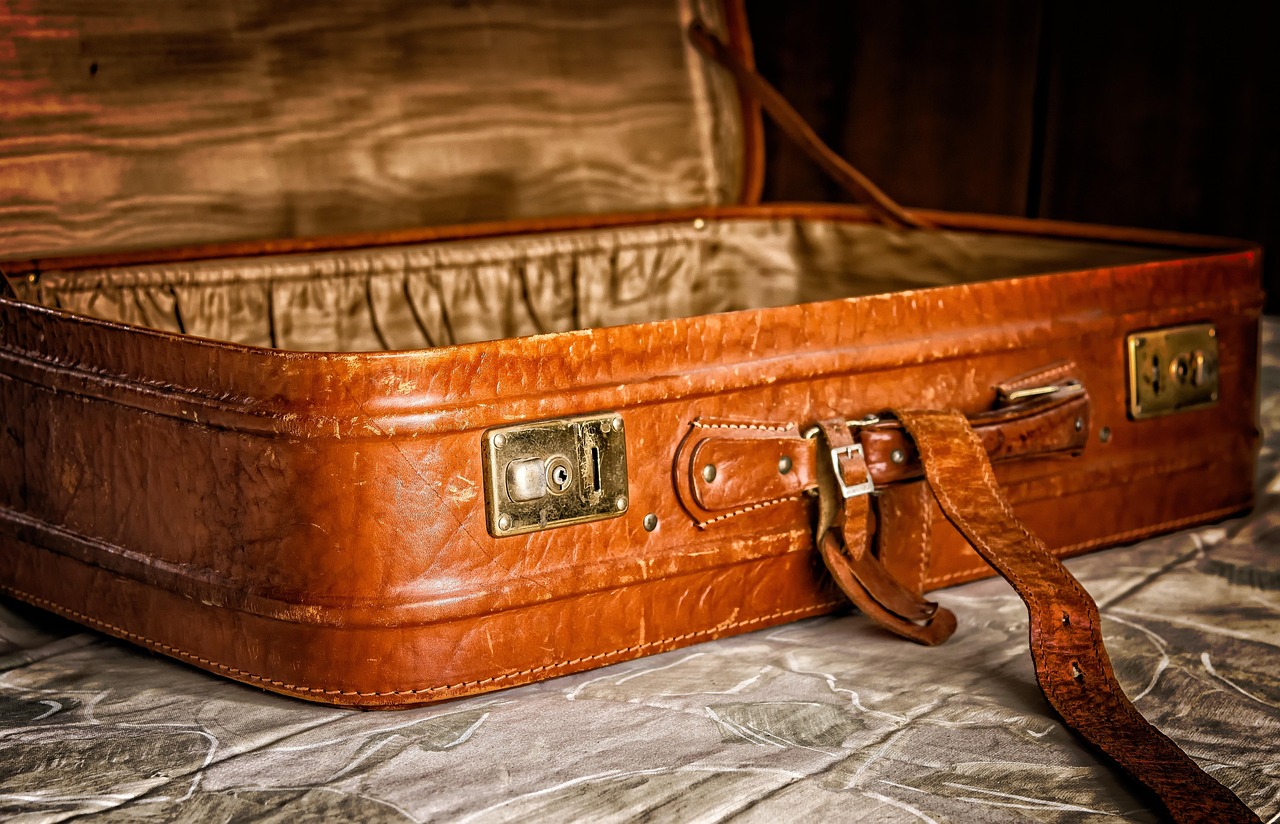Europe travel essentials packing checklist with passport, plug adapter, clothing layers