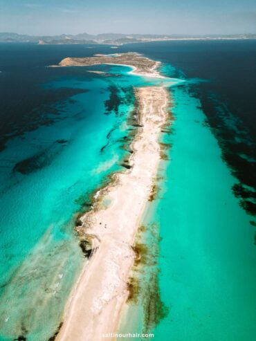Turquoise waters and white sand at a famous Formentera beach in Spain