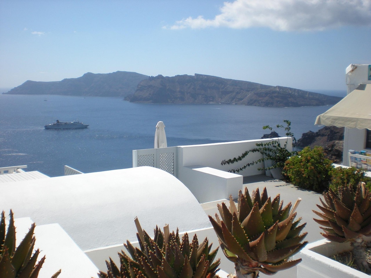 Santorini caldera cruise on a blue sailboat