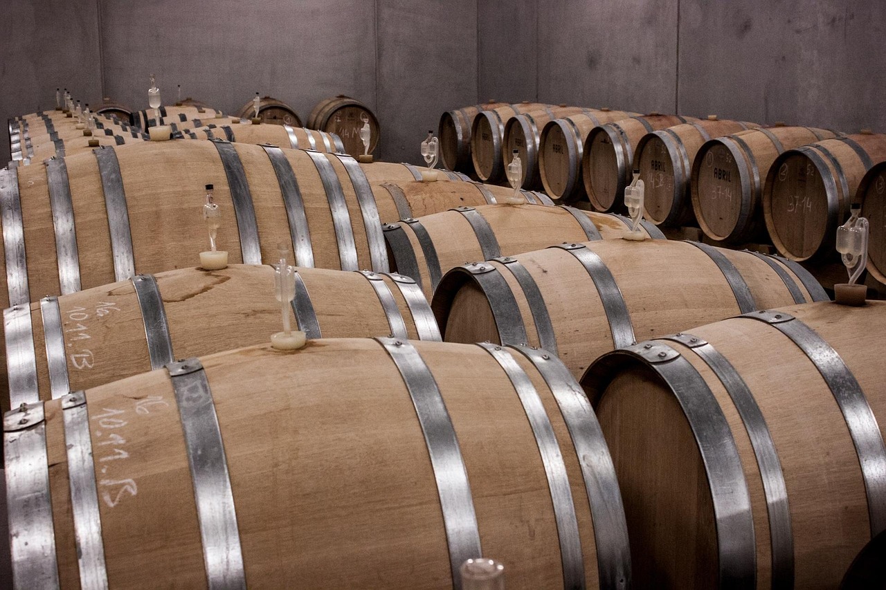 Bottles of Vino Nobile resting in a historic cellar in montepulciano
